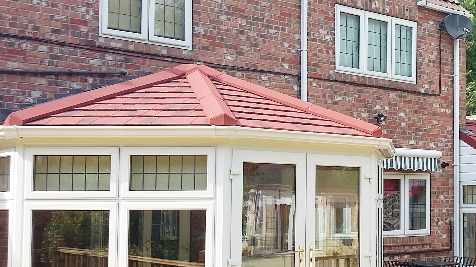 Guardian tiled warm roof fitted to a white conservatory